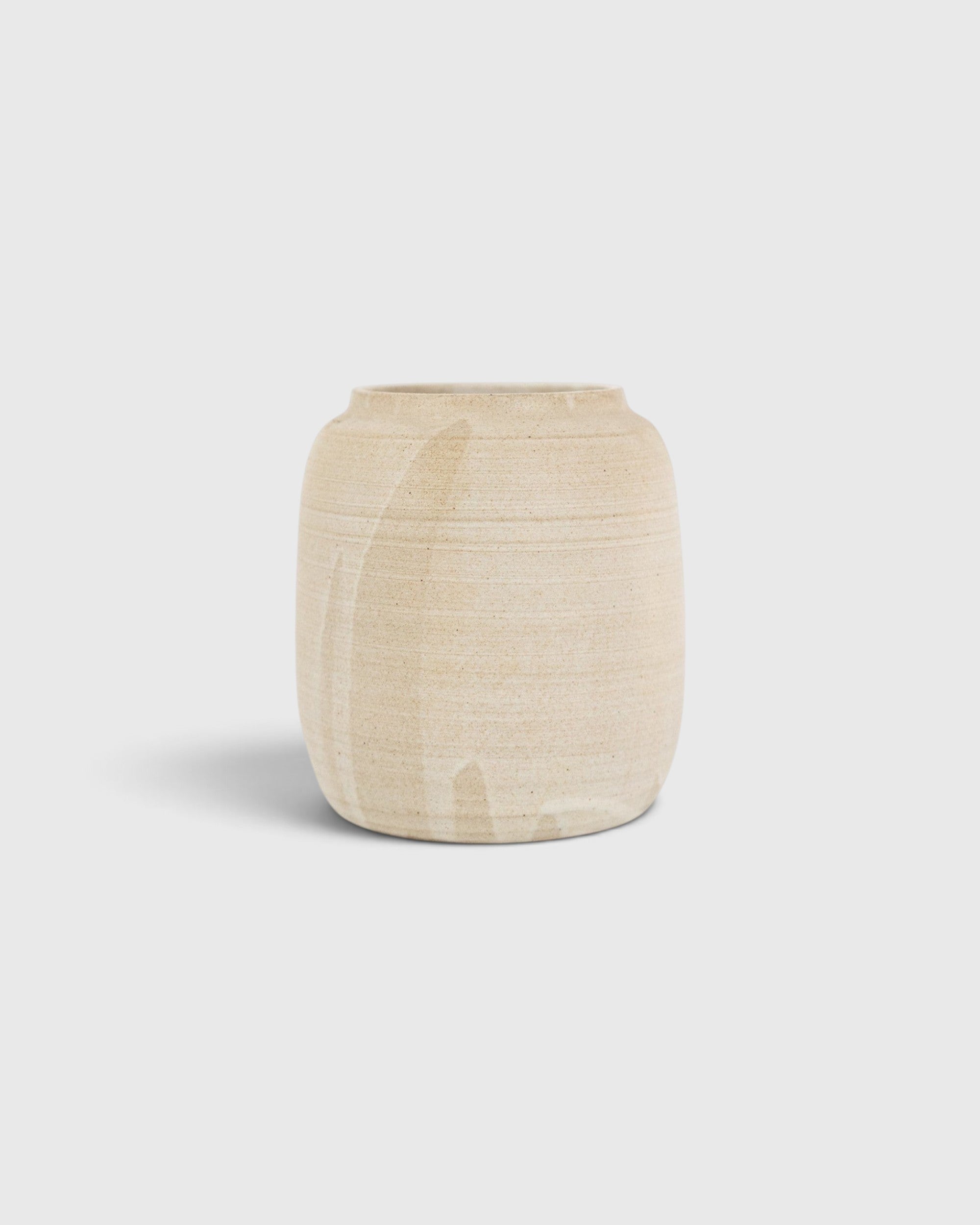 JONES + CO Vase No. 9, a unique handthrown ceramic vase with a textured beige finish and sculptural silhouette.