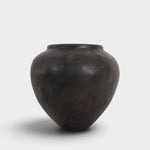 JONES + CO handthrown ceramic vase in dark charcoal with a unique mottled finish and sculptural silhouette.
