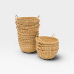 JONES + CO handwoven natural junco petite baskets with handles, ideal for decorative storage or catchalls.
