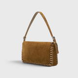 JONES + CO Harlow shoulder bag in cigar brown suede with leather whipstitch detailing and a silver buckle.