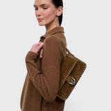 JONES + CO Harlow shoulder bag in cigar suede with whipstitch detailing and a curved silver buckle on the front flap