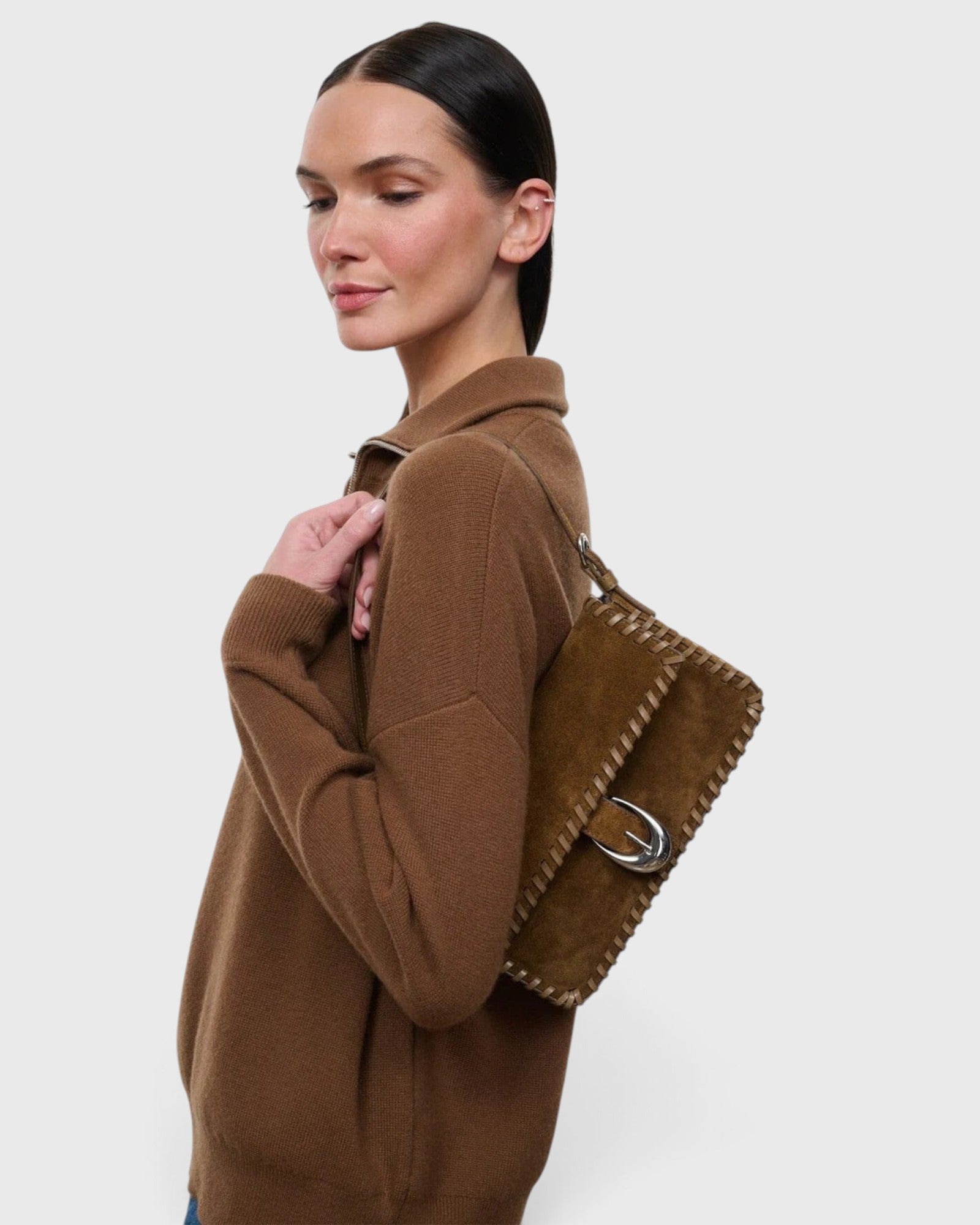 JONES + CO Harlow shoulder bag in cigar suede with whipstitch detailing and a curved silver buckle on the front flap
