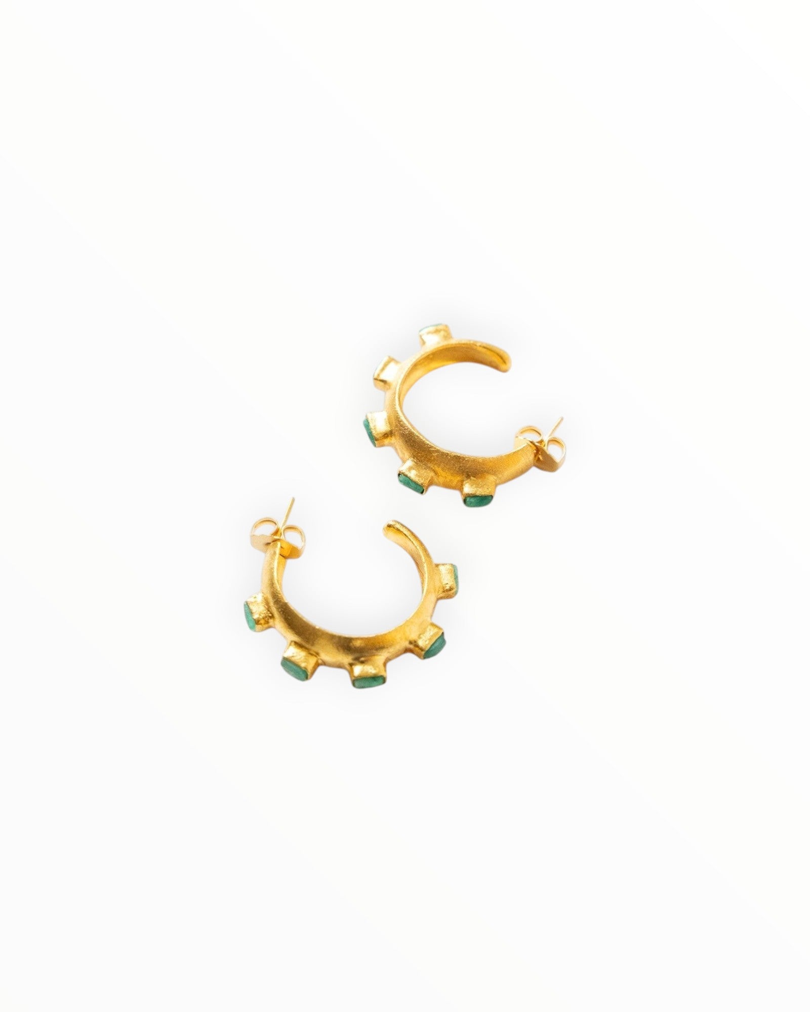 JONES + CO Havana Glow hoop earrings featuring raw Colombian emeralds set in 24K gold-plated brass.