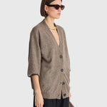 JONES + CO hazelnut cashmere-silk V-neck cardigan with drop shoulders and button front on a model