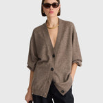 JONES + CO hazelnut cashmere-silk V-neck cardigan with drop shoulders and button-front closure on a model