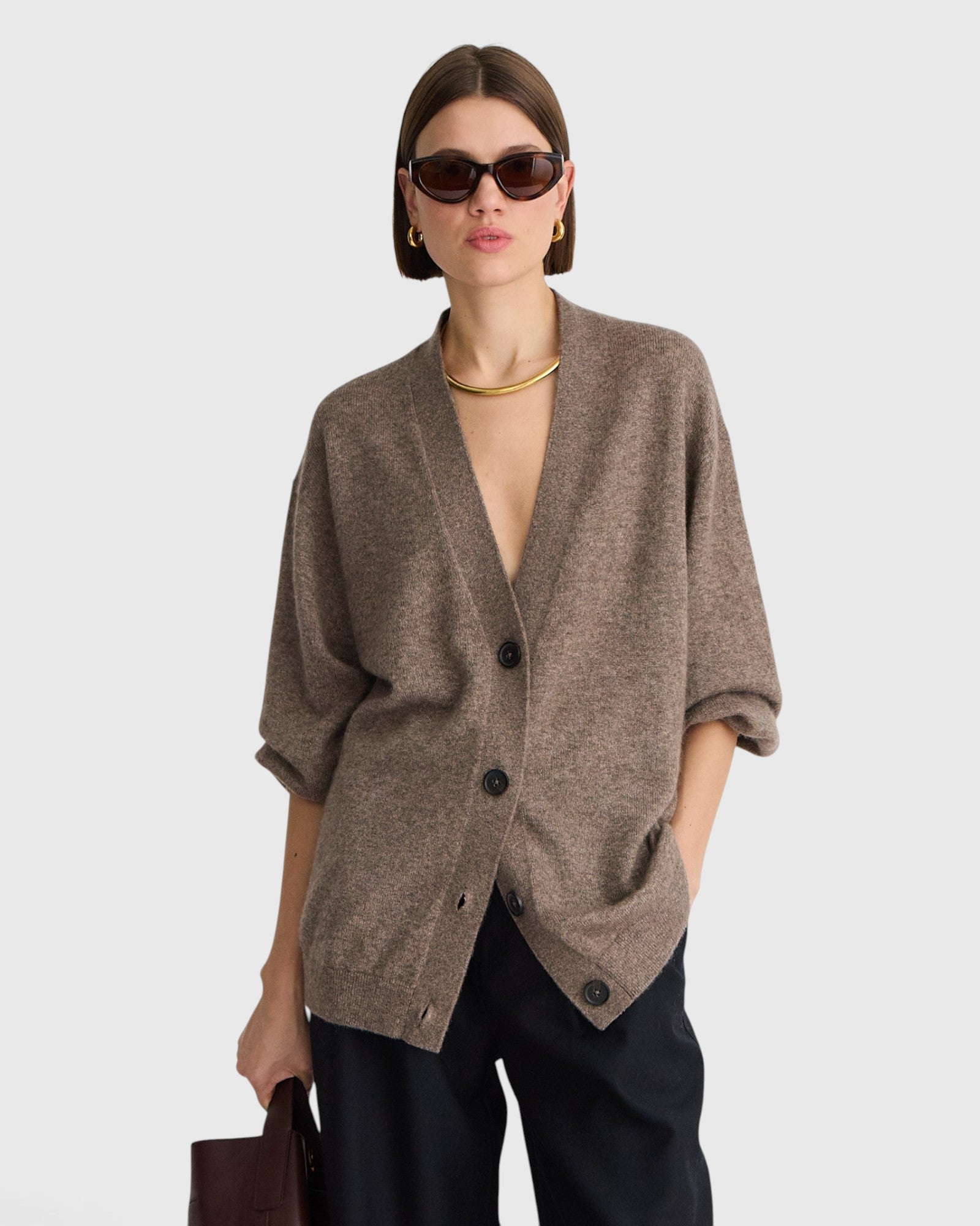 JONES + CO hazelnut cashmere-silk V-neck cardigan with drop shoulders and button-front closure on a model