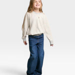 JONES + CO child wearing a heather grey soft cotton fleece Mini Ziggy sweatshirt with an inside-out heritage look.
