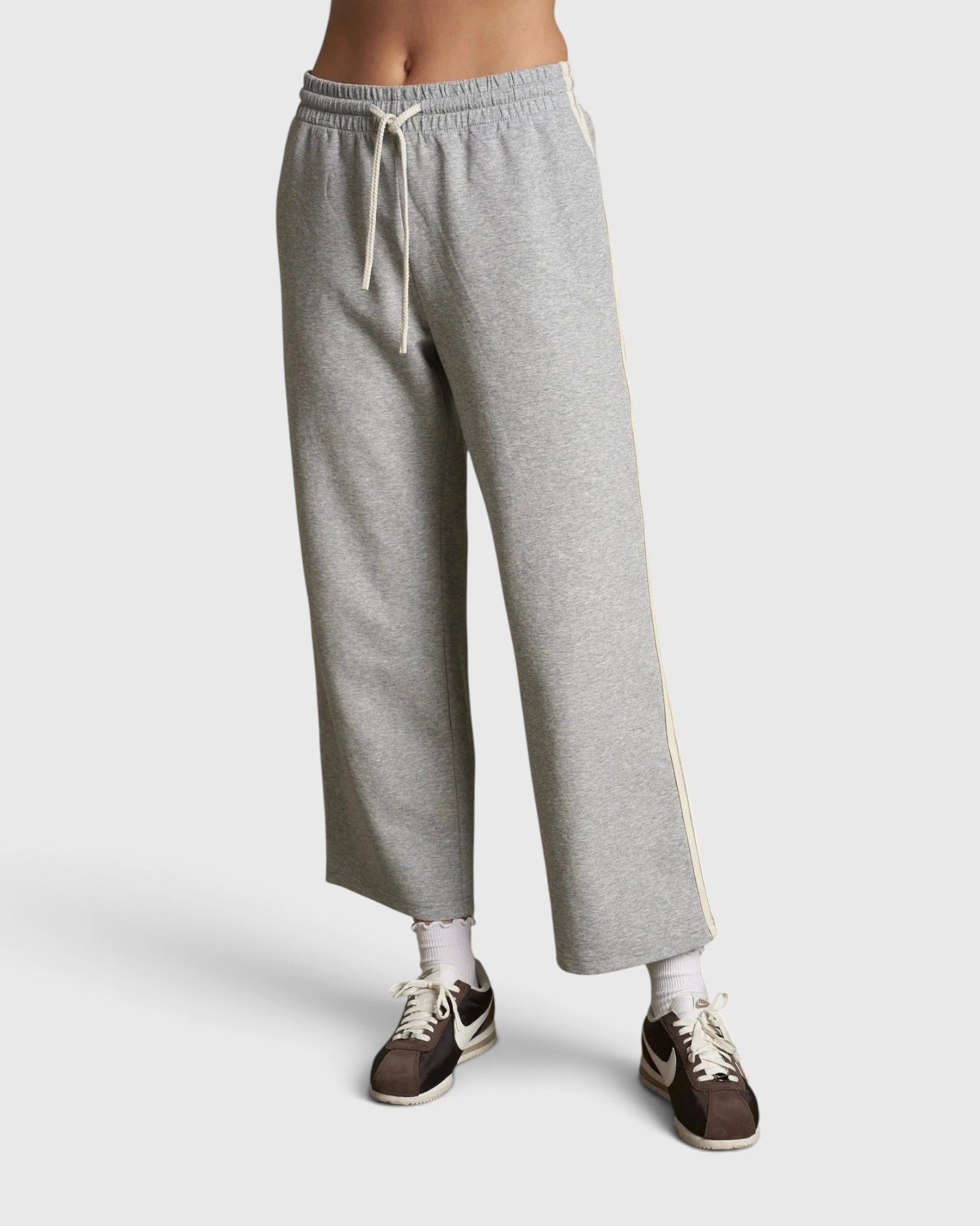 JONES + CO Claud travel track pants in heather grey cotton fleece with an ivory drawstring and side stripe detail.