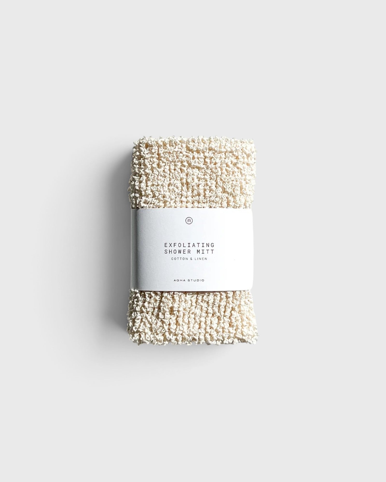 JONES + CO exfoliating shower mitt made from textured cream hemp and cotton fibers with a paper product label