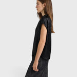JONES + CO Hildra black sleeveless blouse in fluid laminated fabric with kimono shoulders and V-neck, side view