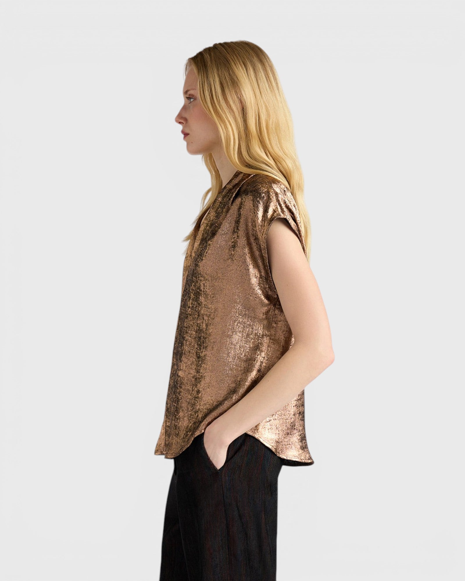 JONES + CO Hildra sleeveless bronze blouse in fluid laminated fabric with a V-neck and kimono shoulder, side view.