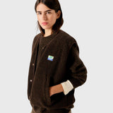 JONES + CO Hoktown sleeveless jacket in chestnut brown shearling fabric worn over a matching sweater