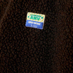 JONES + CO Hoktown sleeveless jacket in chestnut brown shearling fabric with a branded patch detail