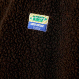 JONES + CO Hoktown sleeveless jacket in chestnut brown shearling fabric with a branded patch detail
