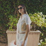 JONES + CO white linen shorts with elastic waistband, paired with a matching short-sleeve button-up shirt.
