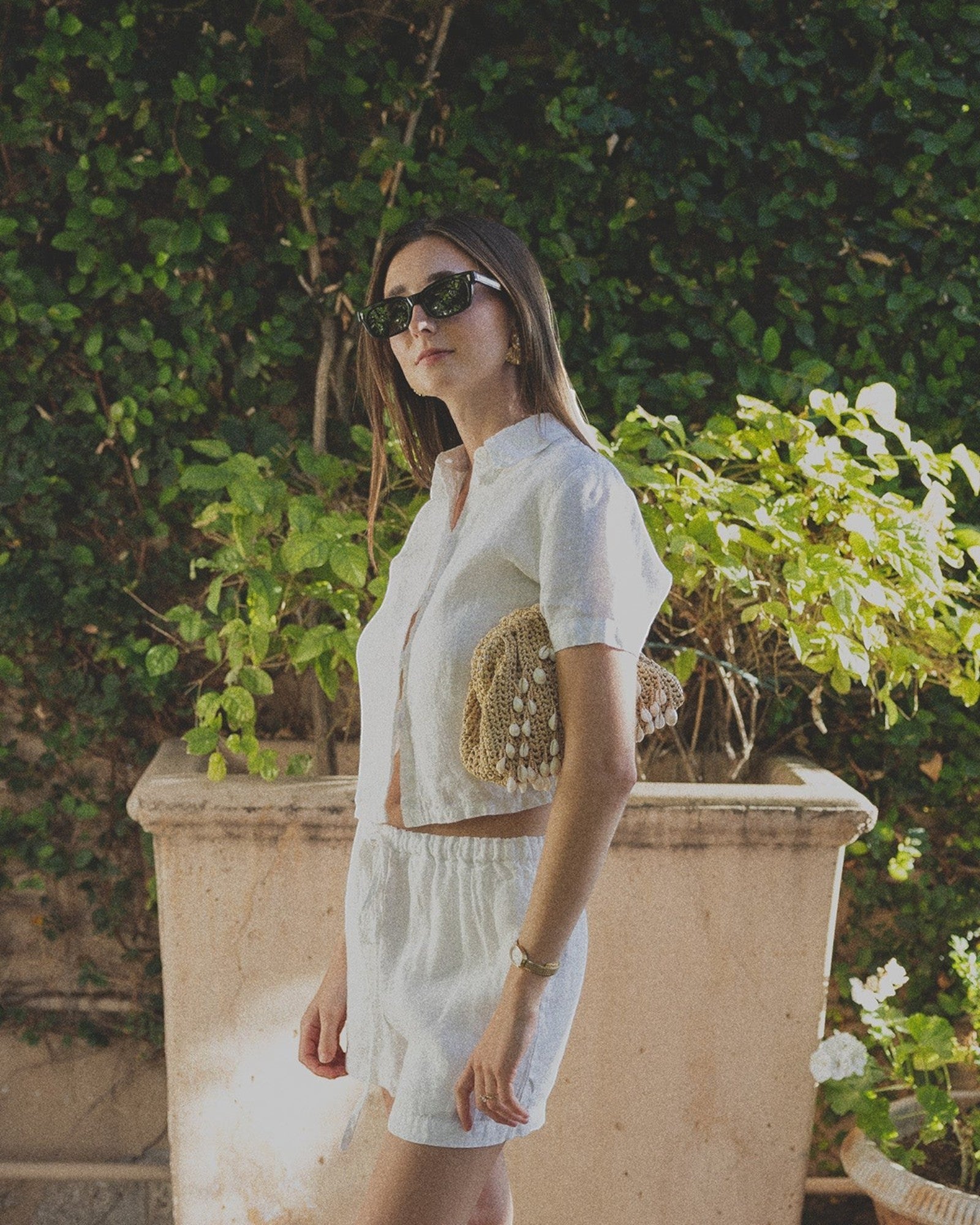 JONES + CO white linen shorts with elastic waistband, paired with a matching short-sleeve button-up shirt.