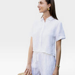 JONES + CO white linen shorts with drawstring waist and matching short-sleeve button-up shirt.