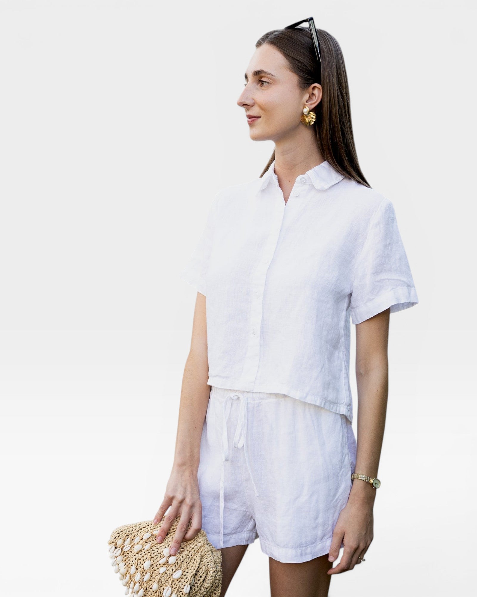 JONES + CO white linen shorts with drawstring waist and matching short-sleeve button-up shirt.