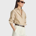 JONES + CO Isolde button-down shirt in sand and blue stripe with oversized fit and dropped shoulders on a model