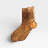 JONES + CO Italian Laminated Socks in gold, made from silk with a metallic foil overlay and ribbed texture.
