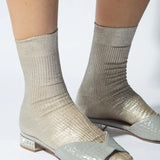 JONES + CO Italian Laminated Socks in platino. Ribbed silk socks with a shimmering metallic foil overlay.