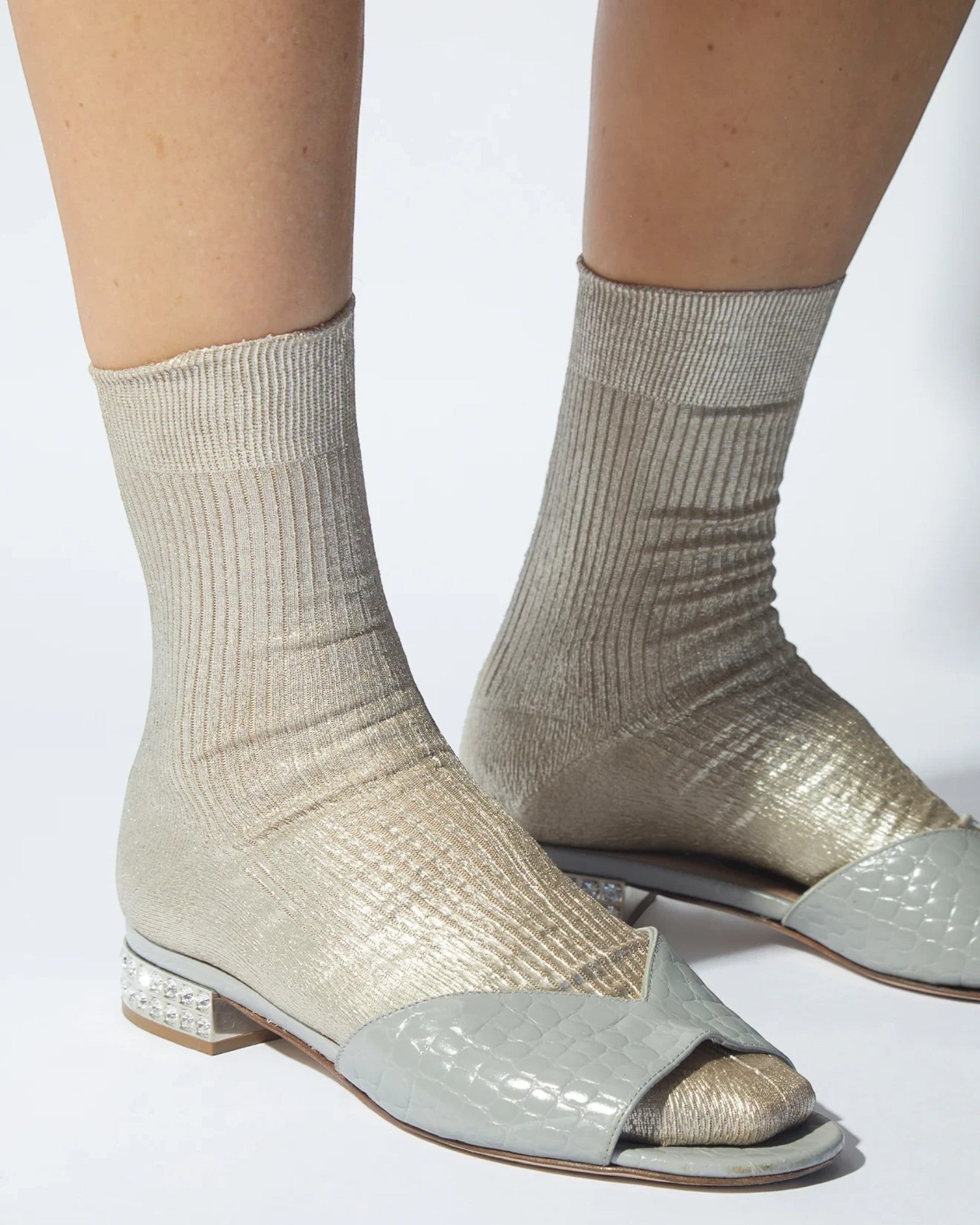 JONES + CO Italian Laminated Socks in platino. Ribbed silk socks with a shimmering metallic foil overlay.