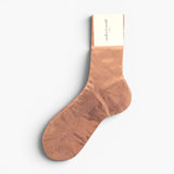 JONES + CO Italian Laminated Socks - Rosa. Ribbed silk socks with a shimmering rose gold metallic foil overlay.