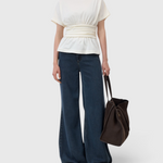 JONES + CO ivory organic cotton jersey T-shirt with a draped waist, straight neckline, and short sleeves.