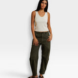 Model wearing a JONES + CO bright ivory ribbed cotton tank top with a scoop neckline paired with olive green pants.