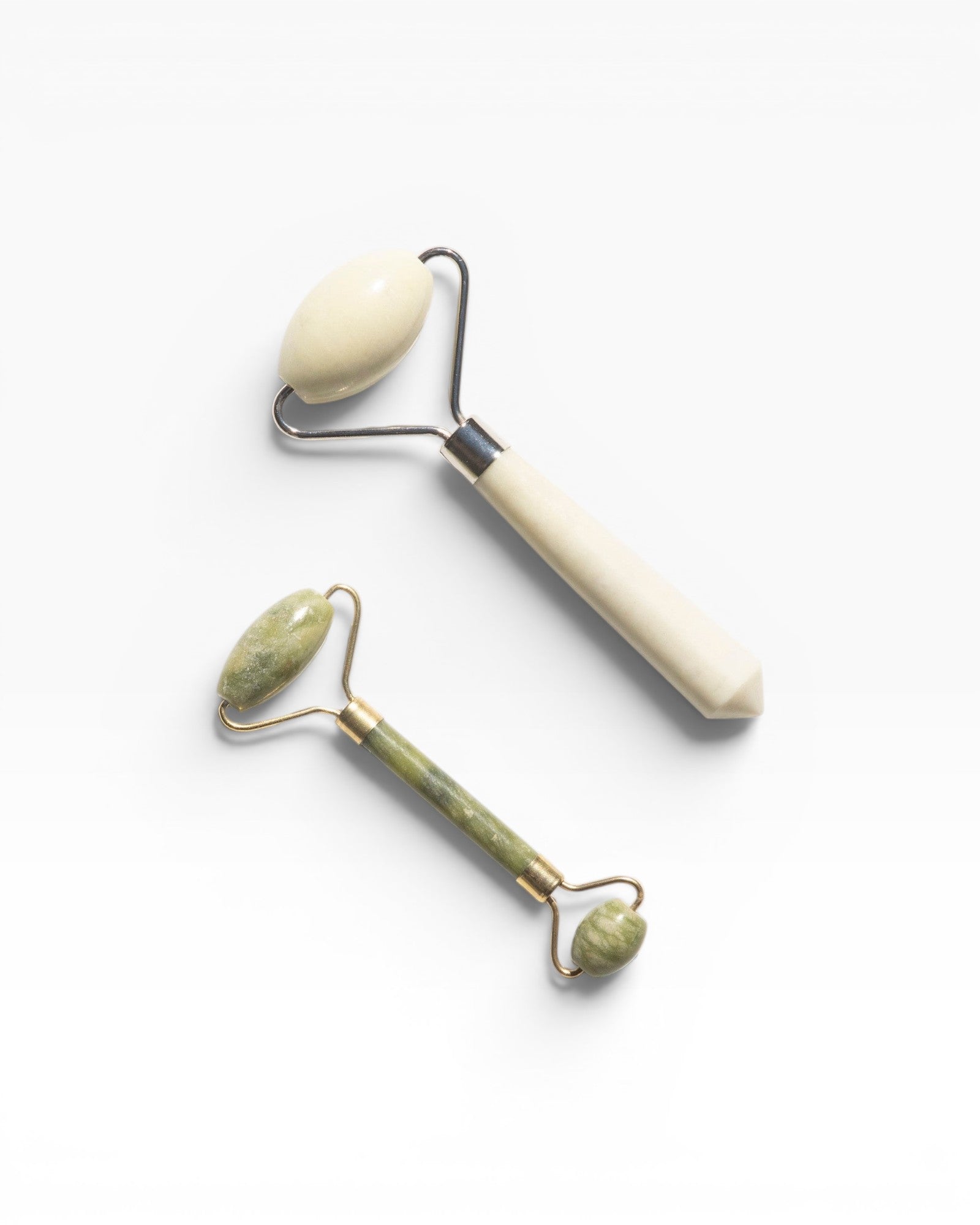 JONES + CO jade rollers in green and cream for depuffing and improved circulation