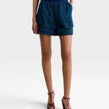 JONES + CO Jalen shorts in muddy indigo denim with elastic waist and two front patch pockets.