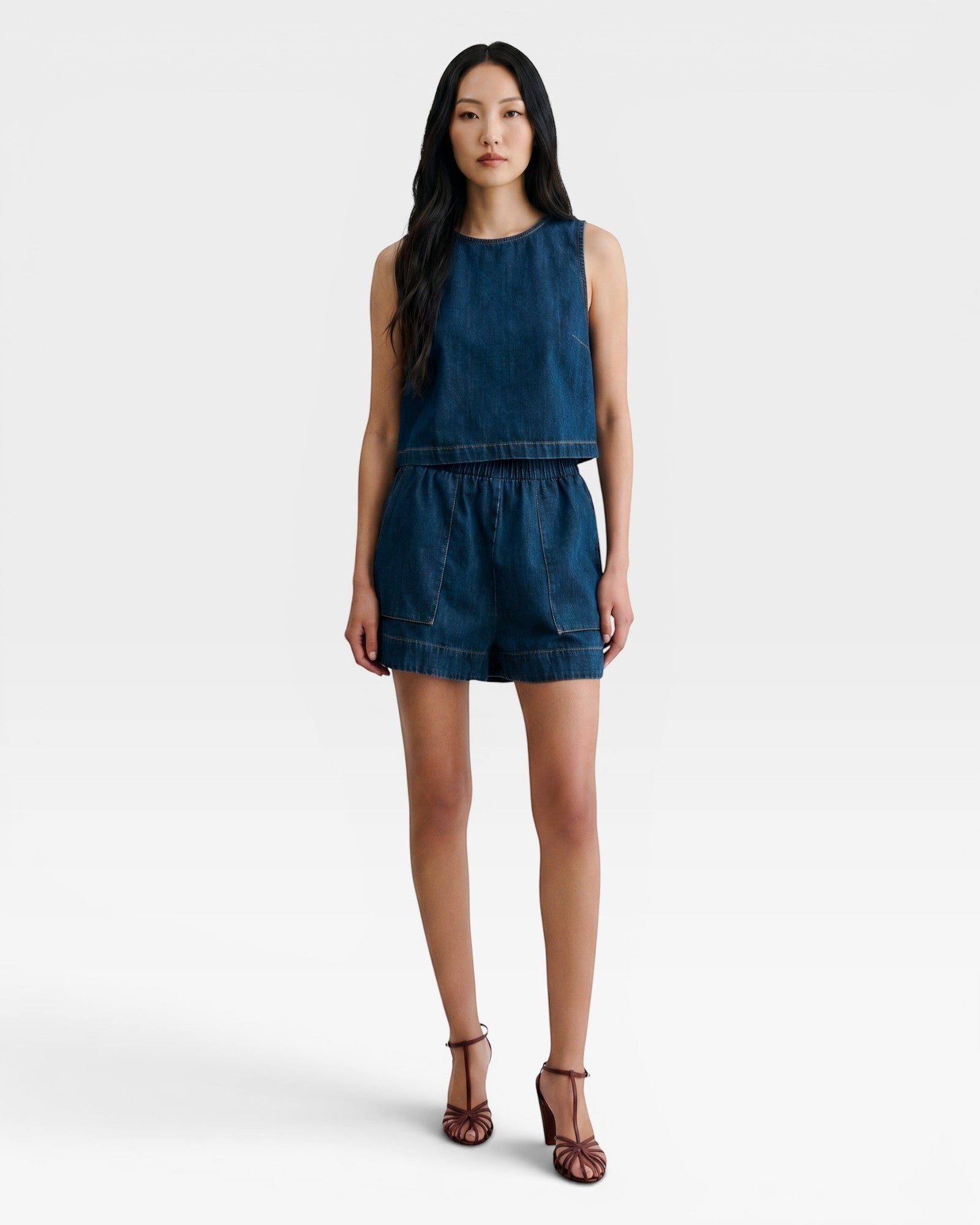 JONES + CO Jalen denim shorts in muddy indigo with elastic waist and two front patch pockets.
