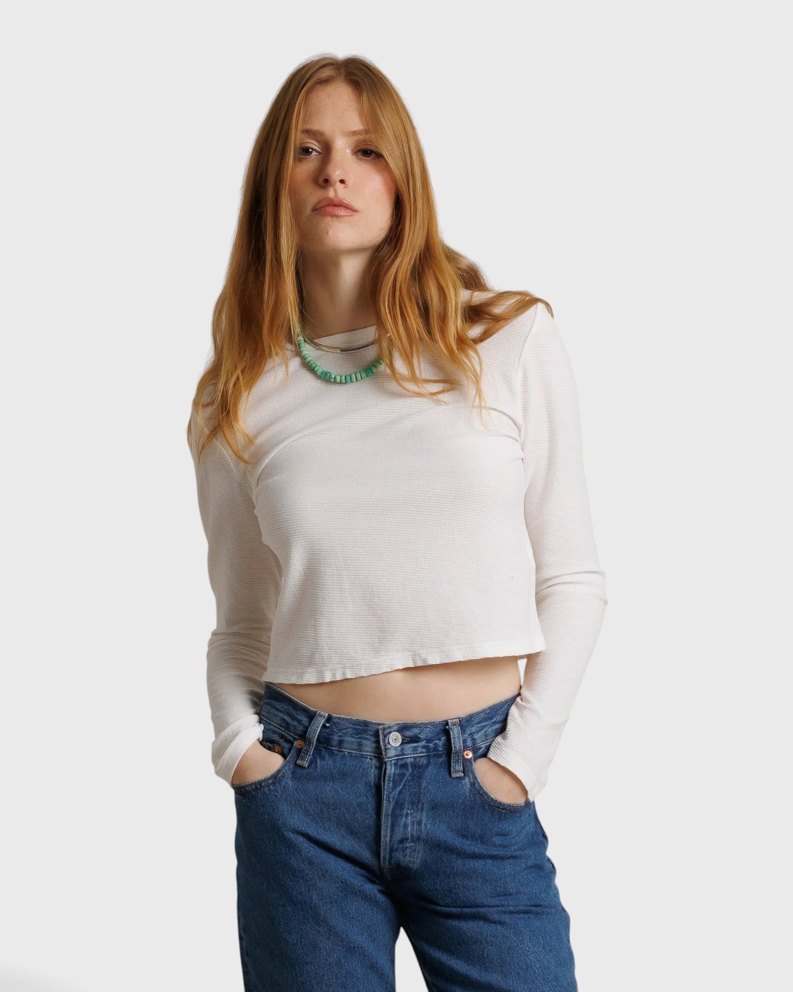 JONES + CO Jamie long sleeve tee in whitecap grey recycled cotton worn by a model with blue jeans