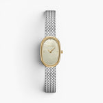JONES + CO Jane Small Tethered watch with a gold oval case, champagne mother of pearl dial, and silver mesh bracelet.