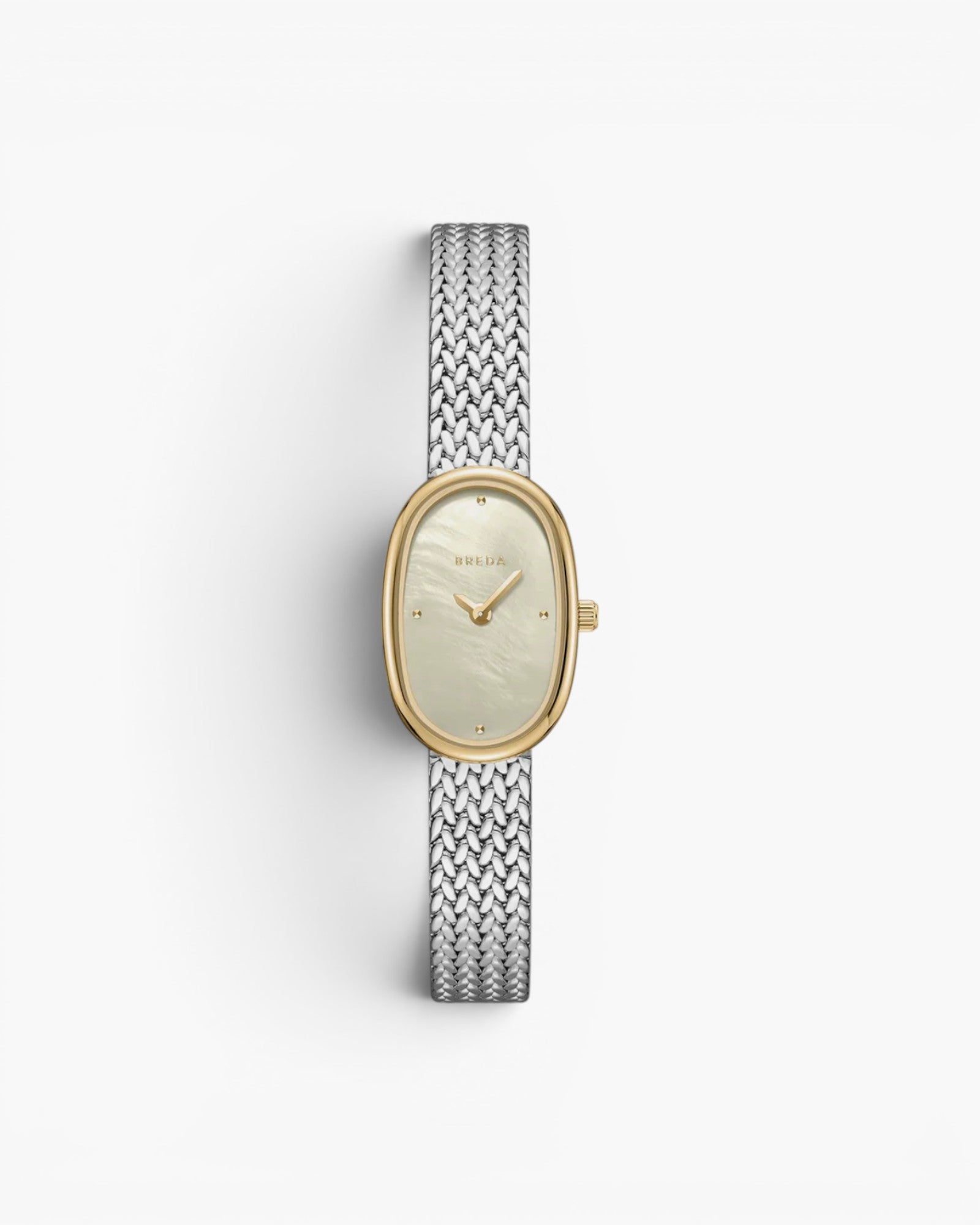 JONES + CO Jane Small Tethered watch with a gold oval case, champagne mother of pearl dial, and silver mesh bracelet.