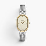 JONES + CO Jane Tethered watch featuring a 23mm oval case, champagne mother of pearl dial, and silver woven mesh strap.