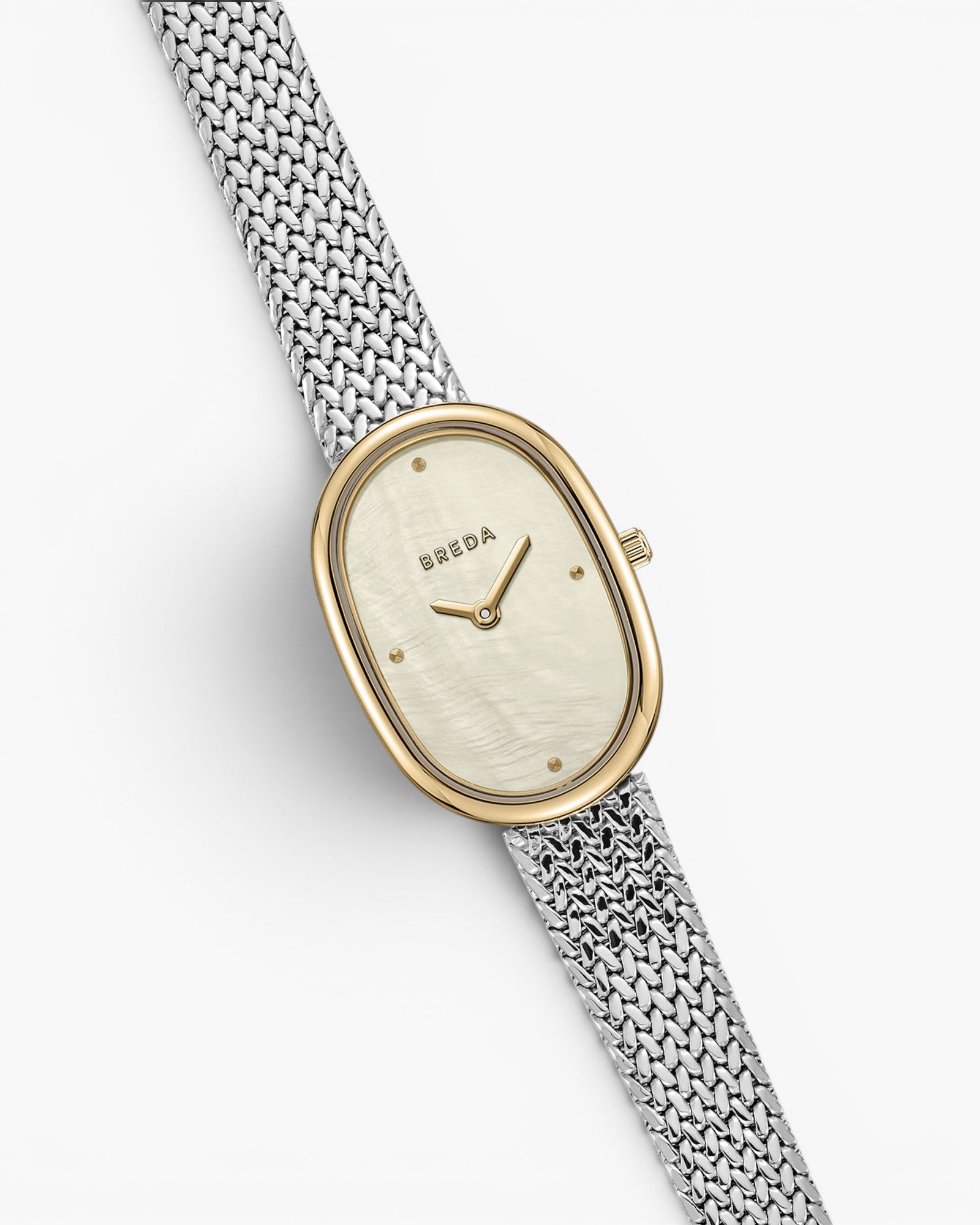 JONES + CO Jane Tethered watch with a 23mm oval case, champagne mother of pearl dial, and silver woven mesh bracelet.