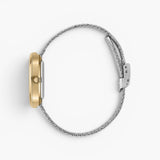 JONES + CO Jane Tethered watch with a gold oval case and silver woven mesh bracelet, side profile view.