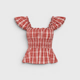 JONES + CO Janne top in terra rosso check with square neckline, frilled cap sleeves, and shirred waist detail.