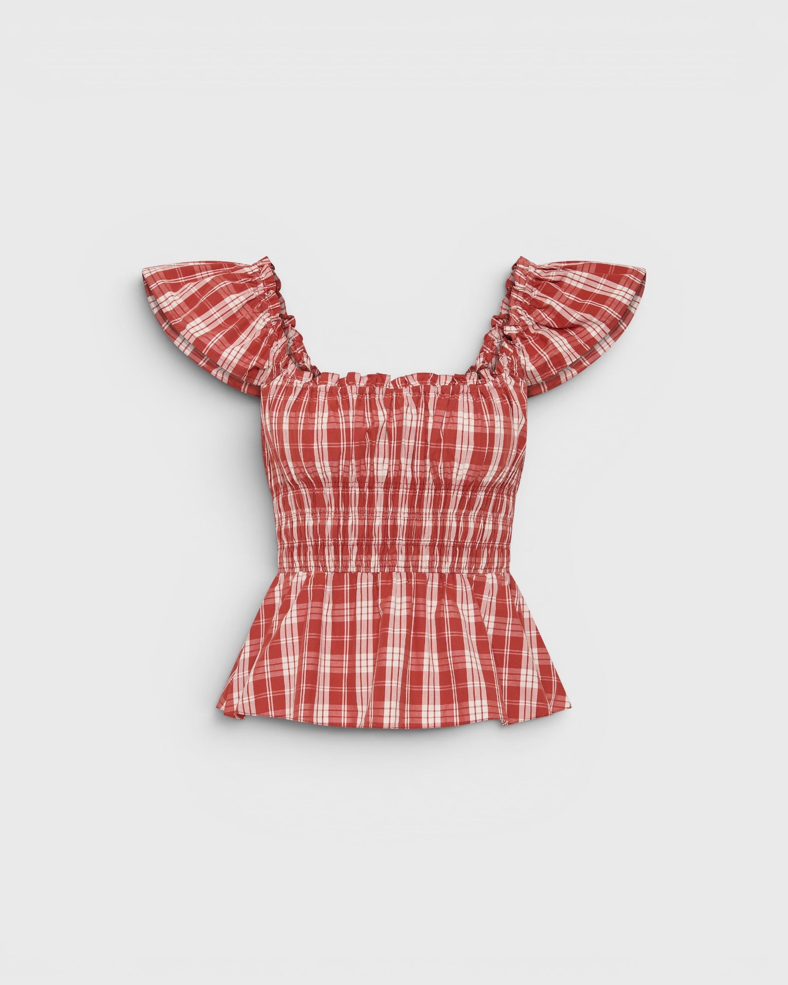 JONES + CO Janne top in terra rosso check with square neckline, frilled cap sleeves, and shirred waist detail.
