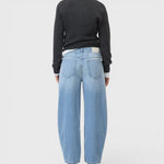 JONES + CO Jazzie barrel jeans in light blue denim with a cropped leg and five-pocket design, back view.