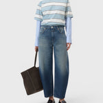 JONES + CO Jazzie barrel jeans in dark blue denim with a cropped leg and mid-rise waist worn by a model.