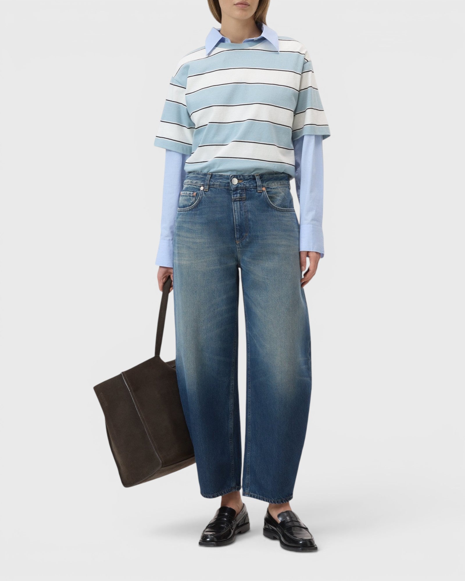JONES + CO Jazzie barrel jeans in dark blue denim with a cropped leg and mid-rise waist worn by a model.