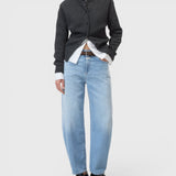 JONES + CO Jazzie barrel jeans in light blue denim with a mid-rise waist and cropped leg on a model