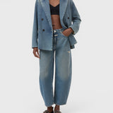 JONES + CO Jazzie barrel jeans in distressed blue denim with a matching denim blazer on a model
