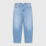 JONES + CO Jazzie barrel jeans in light blue denim with a mid-rise waist and cropped leg silhouette.