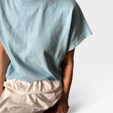 JONES + CO Jeanne Tee in sky blue, a short-length muscle tee with dolman sleeves and a high crew neck.