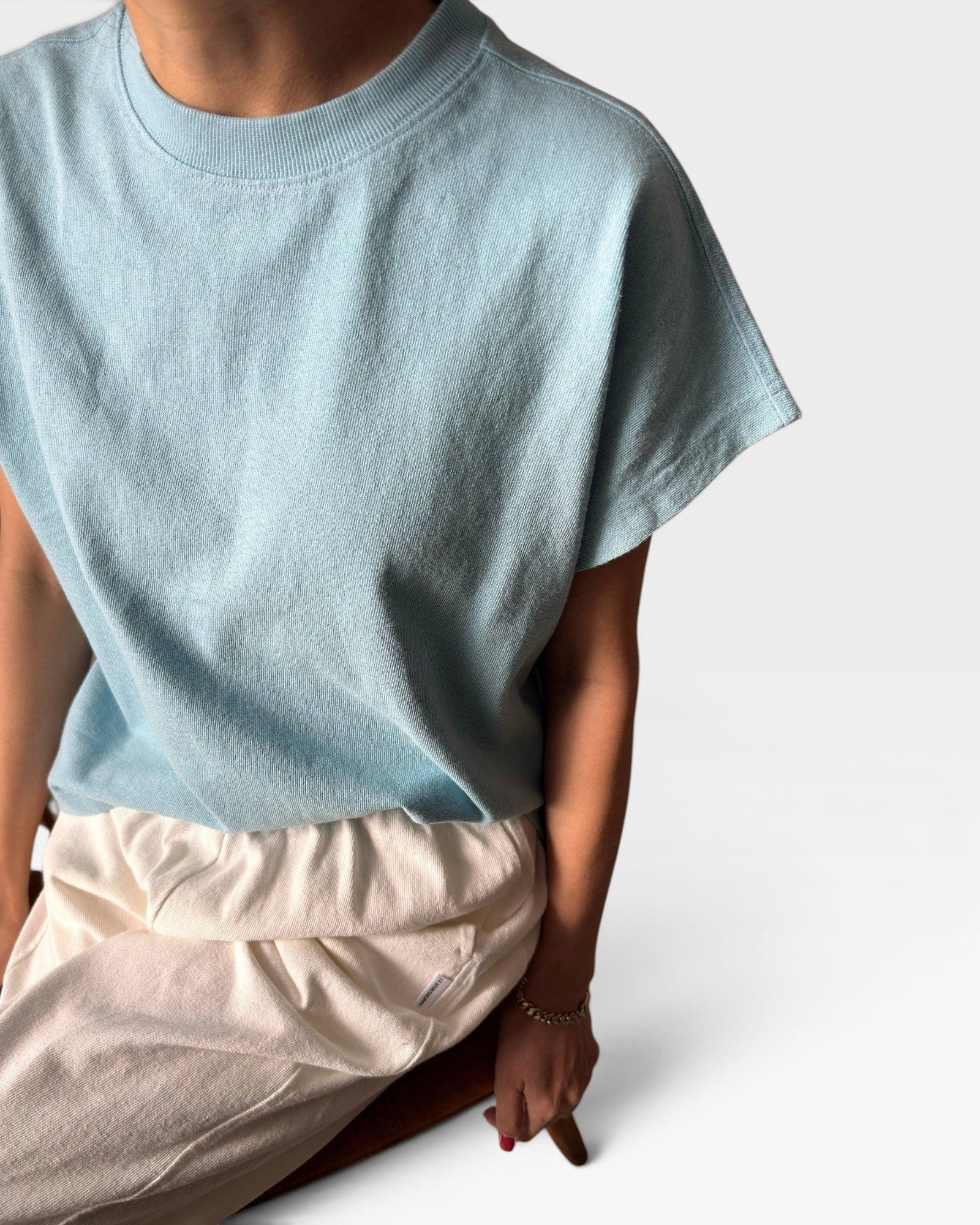 JONES + CO Jeanne Tee in sky blue, a short-length muscle tee with dolman sleeves and a high crew neck.