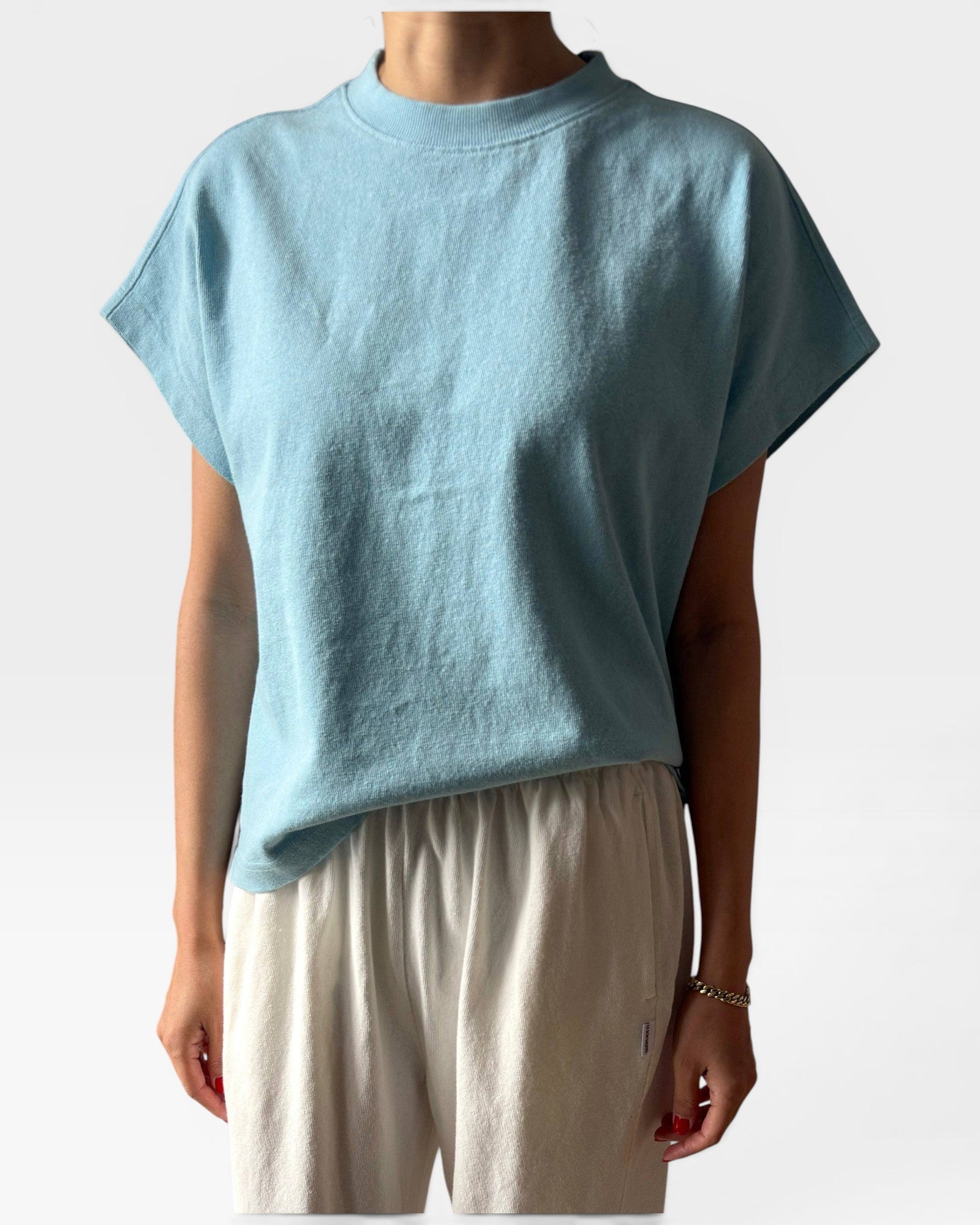 JONES + CO Jeanne Tee in sky blue. Muscle tee with dolman sleeves and high crew neck.