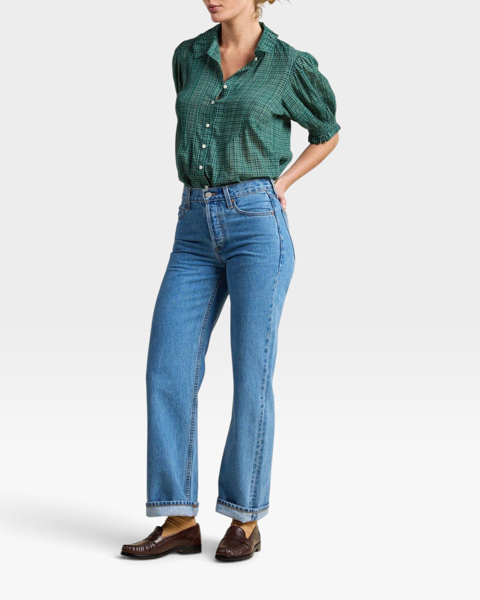 JONES + CO Jess Blouse in green Muir Tartan with short puff sleeves, pintuck details, and a curved hemline.